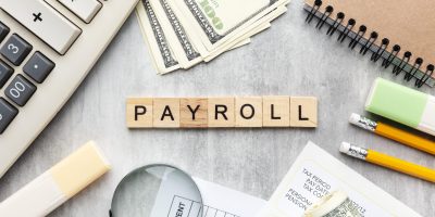 top-view-payroll-concept-with-items